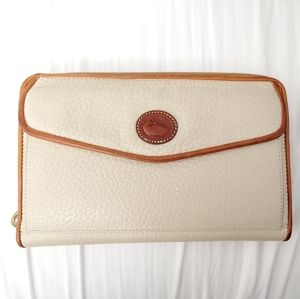 Dooney and Bourke All Weather Leather Crossbody Wallet in beige or cream